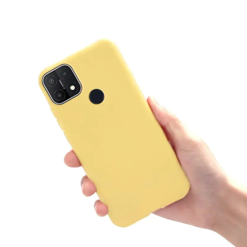 a hand holding a yellow iphone case