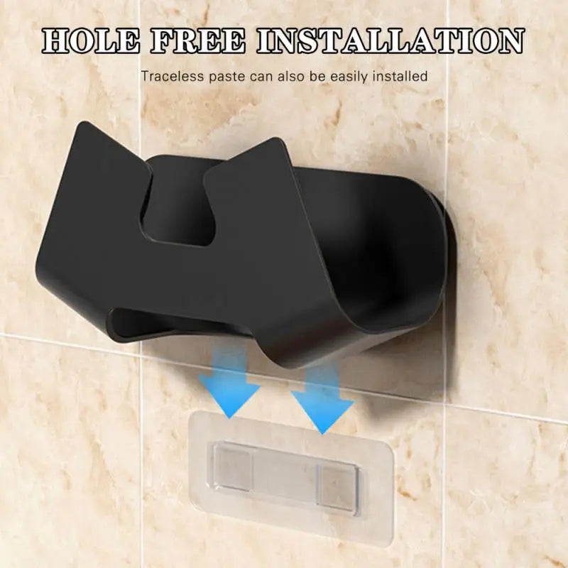 a black toilet roll holder with a blue arrow pointing up the side of the roll