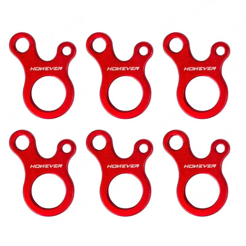 a set of four red plastic bottle openers