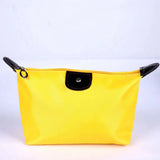 a yellow cosmetic bag with black handles