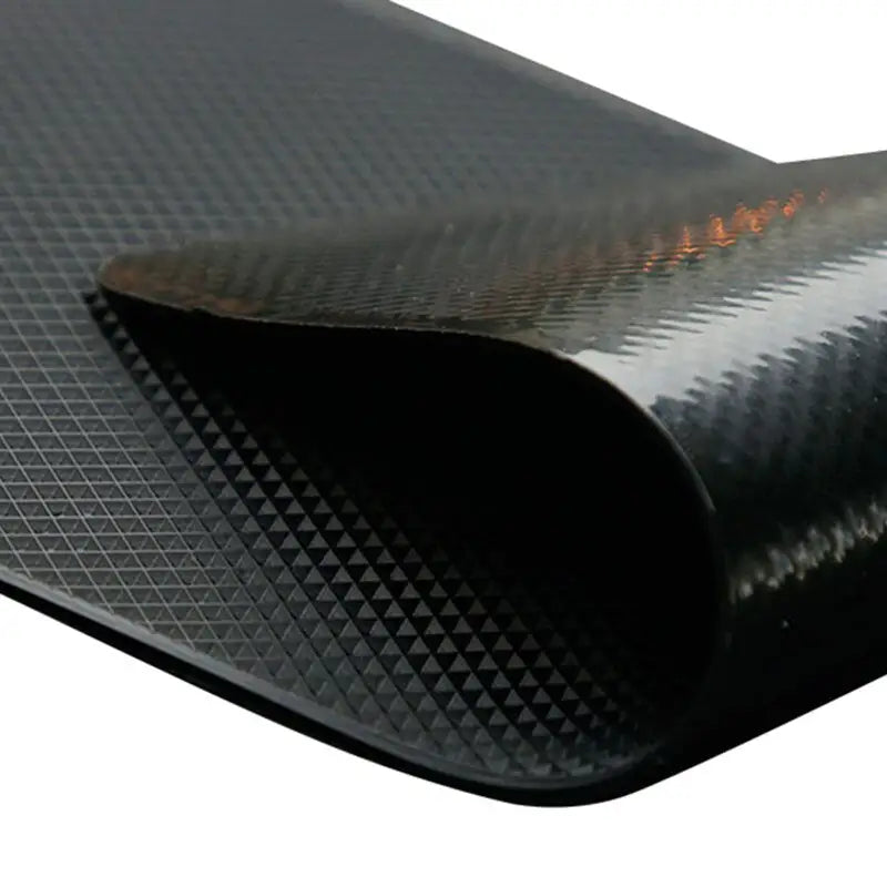 a black rubber sheet with a white background