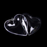 two glass hearts on a black background