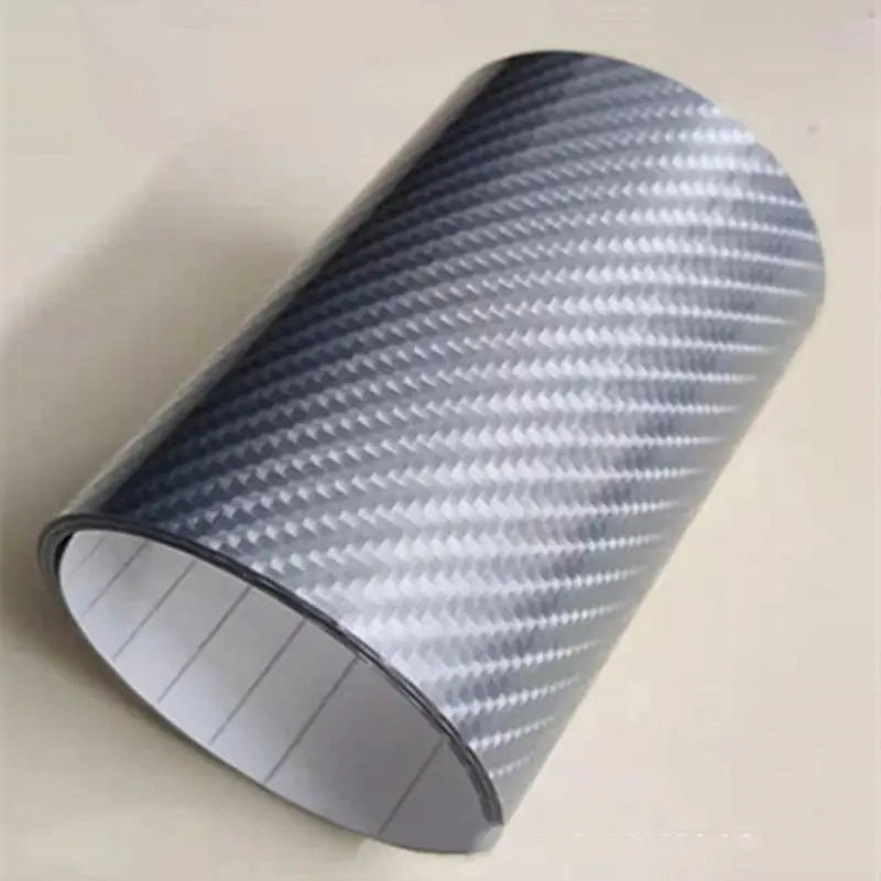 a close up of a roll of silver carbon fiber