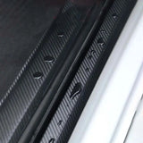 a close up of a car door handle with a black sticker