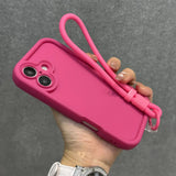 Hot pink silicone phone case with a matching wrist strap.