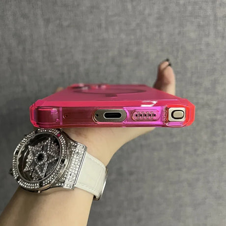 A hot pink, translucent phone case with reinforced corners and precise cutouts for the charging port, speakers, and mute switch.