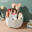 a white container with makeup brushes and other items