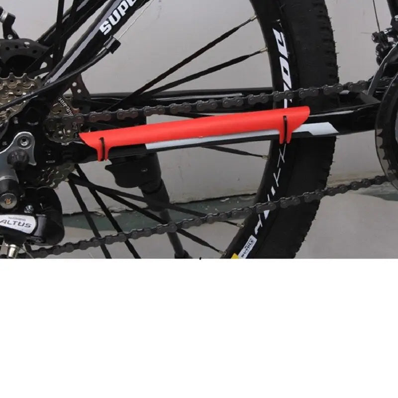 a bicycle with a chain and chain guard