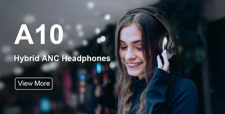 Hybrid ANC headphones being worn by a smiling person with long dark hair.