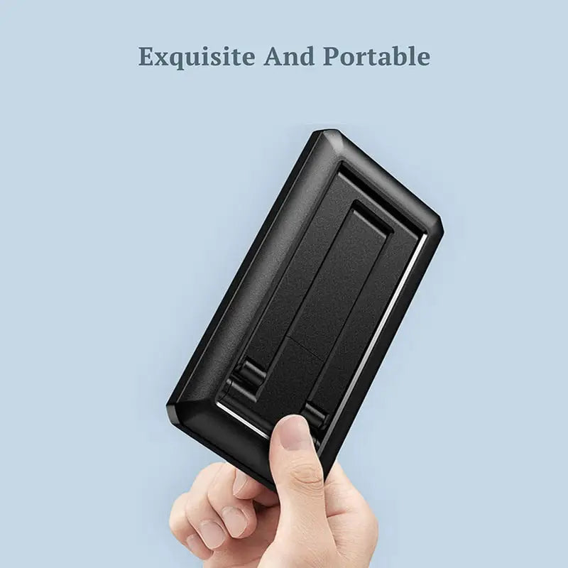 a hand holding a black plastic card case