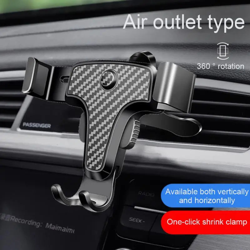 a close up of a car dashboard with a cell phone holder attached to it