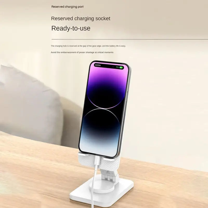 there is a phone on a stand on a table