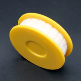 a yellow plastic roller with a white foam inside