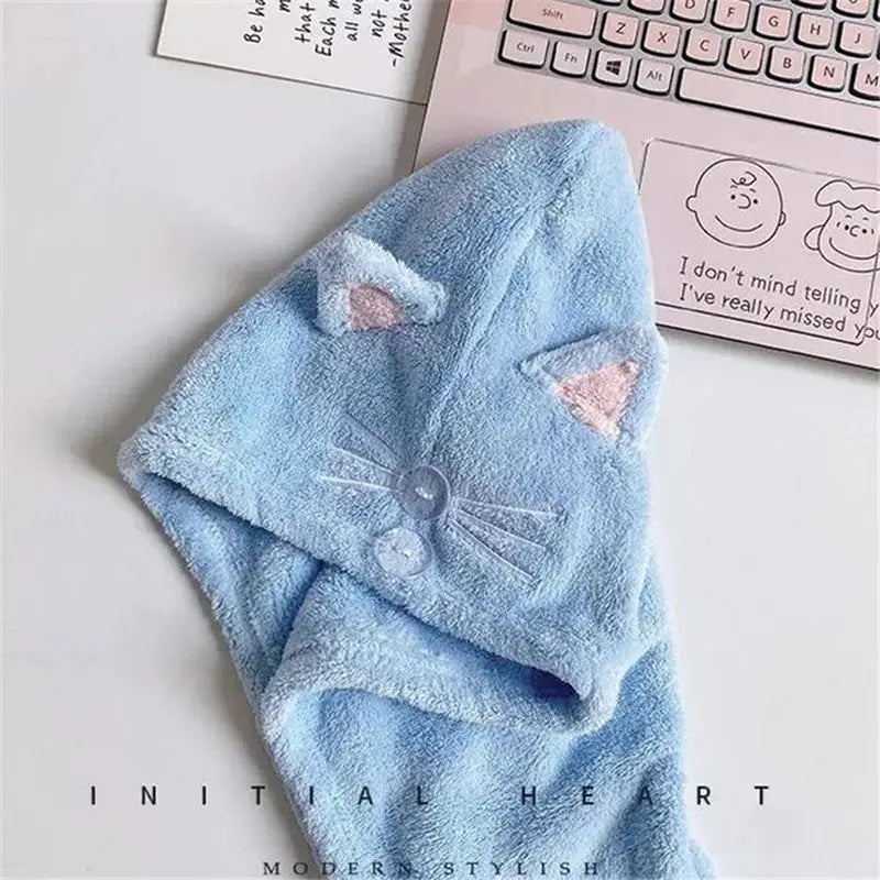 a blue towel with a cat on it