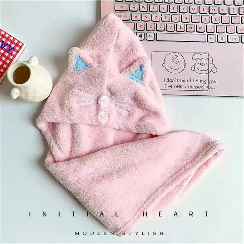 a pink towel with a cat face on it