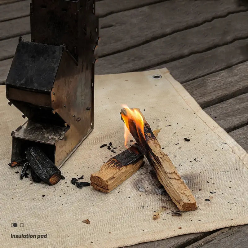 a small fire is lit on a napkin