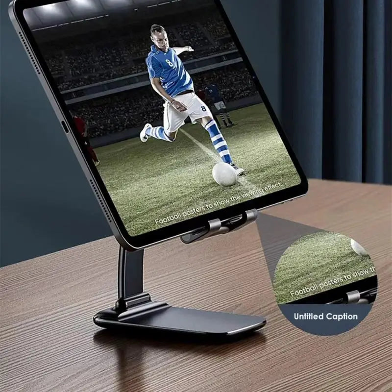 the tablet is on a table with a soccer ball