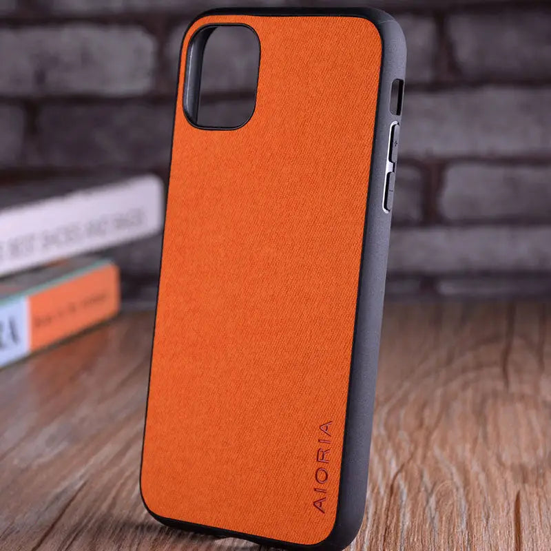 the back of an orange leather iphone case
