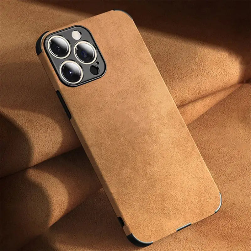 the back of a brown leather case with a camera
