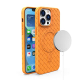 the back of an orange leather case with a phone holder