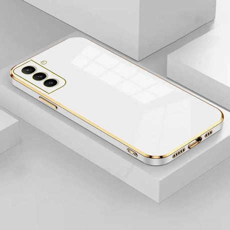 The iphone 11 is a gold case with a white back and gold sides