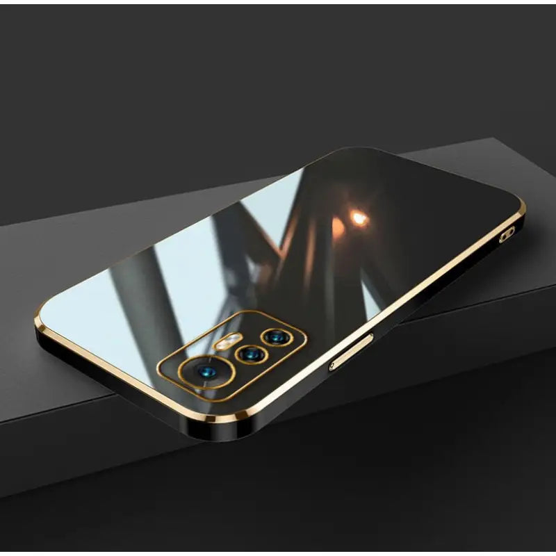 the iphone 11 is a gold - plated case with a mirror