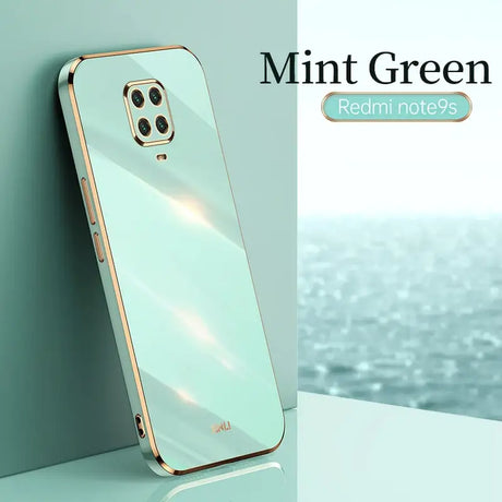 the mint green iphone case is shown on a white surface