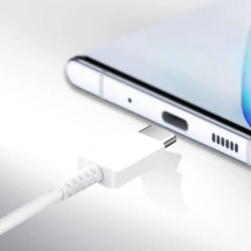 an iphone with a charging cable attached to it