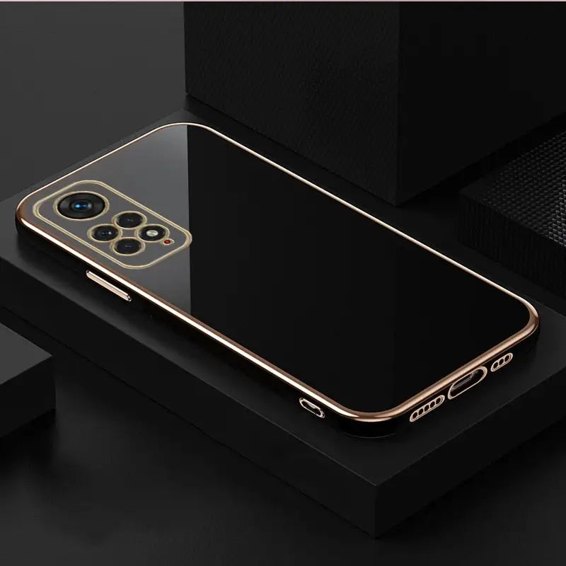 a gold iphone case on a black surface