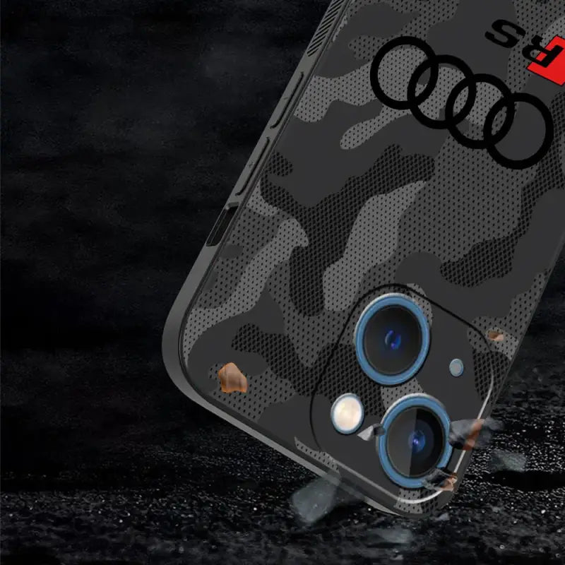 The iphone case with a cam pattern and two blue lenses