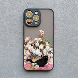 IPhone case featuring a floral design with a black cat.