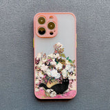 IPhone case with a floral design and black cat illustration.