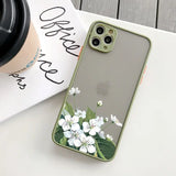 a white flower on a green phone case