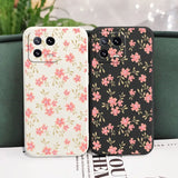 a pair of iphone cases with pink flowers on them