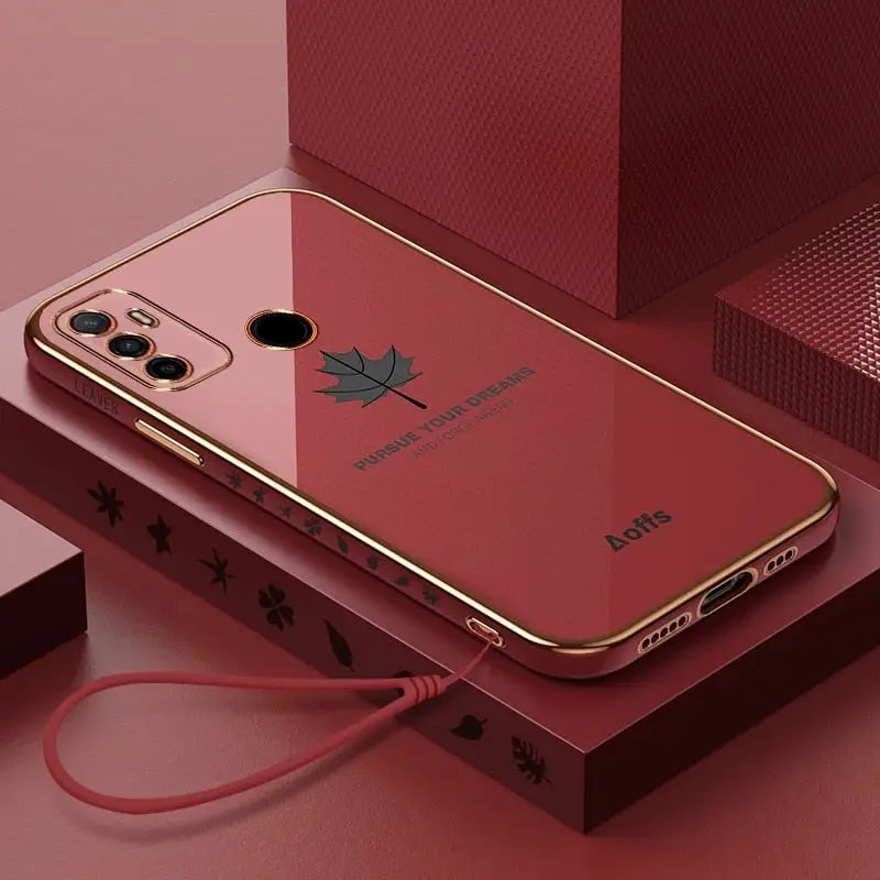 a red iphone case with a gold frame and a red phone case