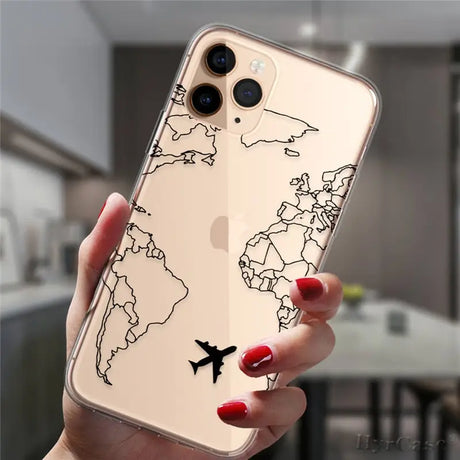 a woman holding a phone case with a world map on it