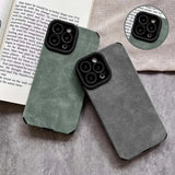the iphone case is made from felt and has a leather cover
