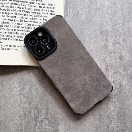 The iphone case is made from a soft grey sued material