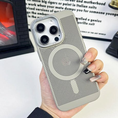 IPhone case with a perforated circular speaker design and camera cutouts.