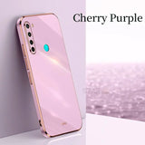 the iphone case is pink and has a blue circle on it