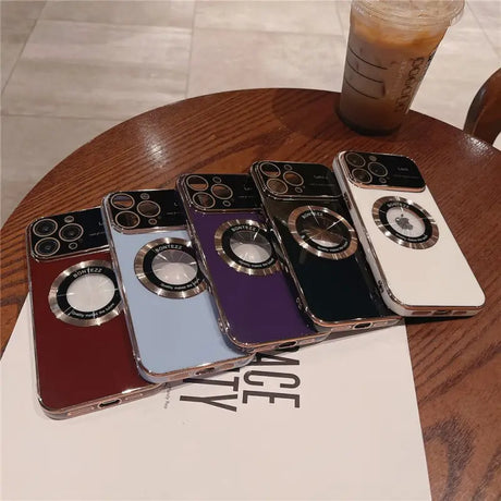 three iphone cases sitting on top of a table