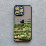 IPhone case featuring a whimsical adaptation of Monet’s water lilies painting with a black cat on the bridge.