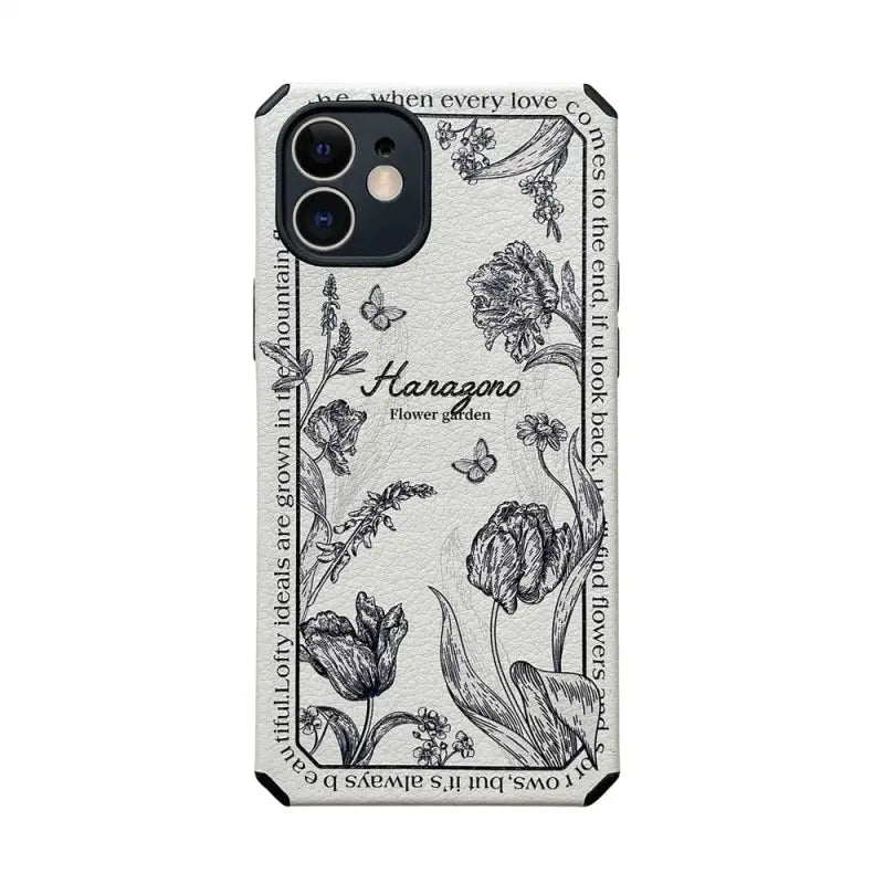 the iphone case is made from a white leather with black and white florals