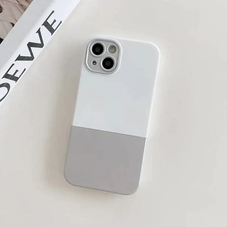 The iphone case is sitting on a white table