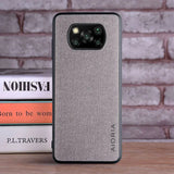 the back of a gray iphone case sitting on a table