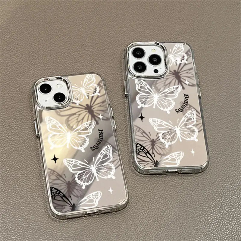two iphone cases with butterflies on them