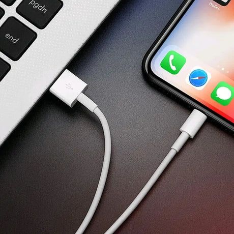 an iphone with a charging cable attached to it