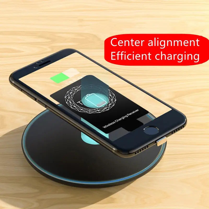 an iphone charging station with a phone on top