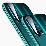 two green iphones with a camera lens on top of them