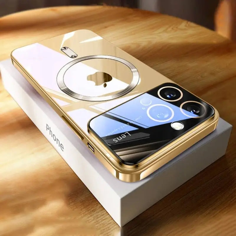 an iphone with a gold case on top of it